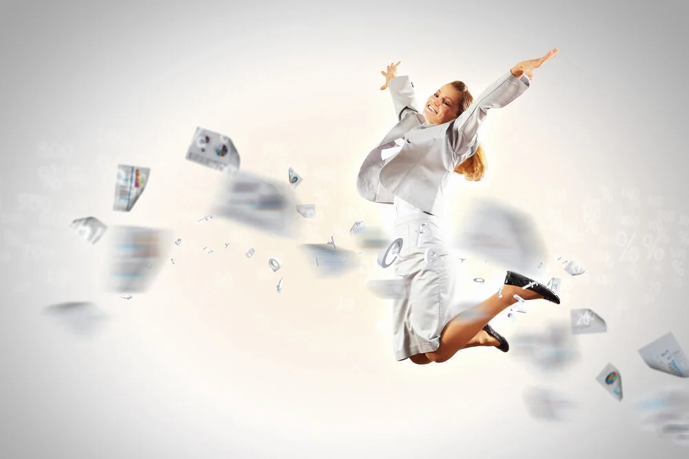 happybusinesswomanjumpinginair